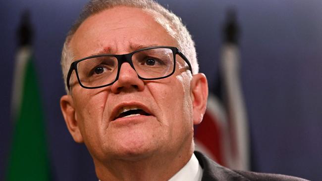 Australia's former prime minister Scott Morrison speaks to media during a press conference in Sydney on August 17, 2022. - Australia's Prime Minister Anthony Albanese on August 16 said that his predecessor Scott Morrison secretly seized control of five ministerial posts, labelling it an "unprecedented trashing of our democracy". (Photo by Steven Saphore / AFP)