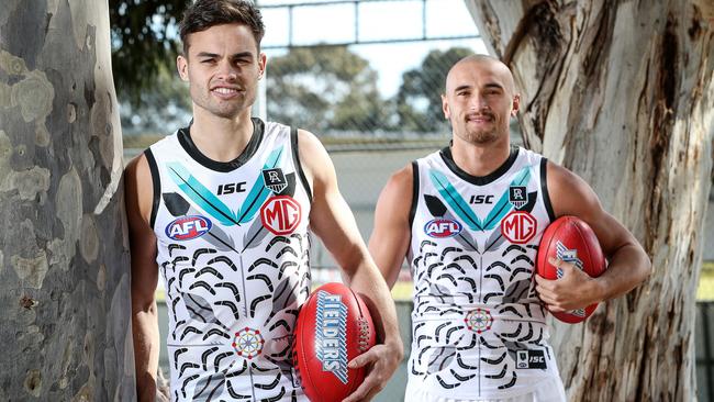 Karl Amon and Sam Powell-Pepper model the 2020 indigenous jumper. Picture: Sarah Reed