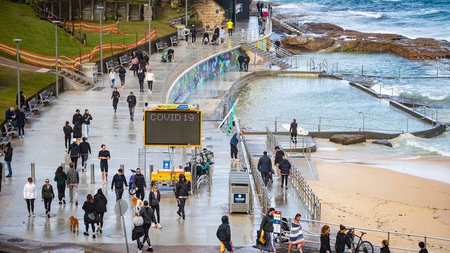 People exercising at Bondi Beach under lockdown restrictions on Sunday morning. Picture: Julian Andrews