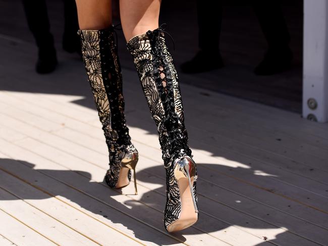 Knee high boots in the Mumm Marquee at the Birdcage on Derby Day. Picture: Tracey Nearmy, AAP Image.