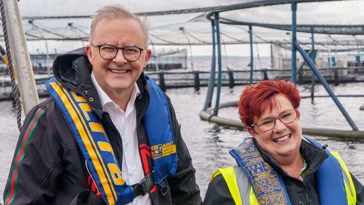 STRAHAN, TASMANIA, AUSTRALIA – NewsWire Photos – 14 DECEMBER, 2024: The Australian Prime Minister Anthony Albanese (L) and Tasmanian Senator Anne Urquhart (R) visit the Tassal salmon pens in Strahan, Tasmania. Picture: POOL / NewsWire