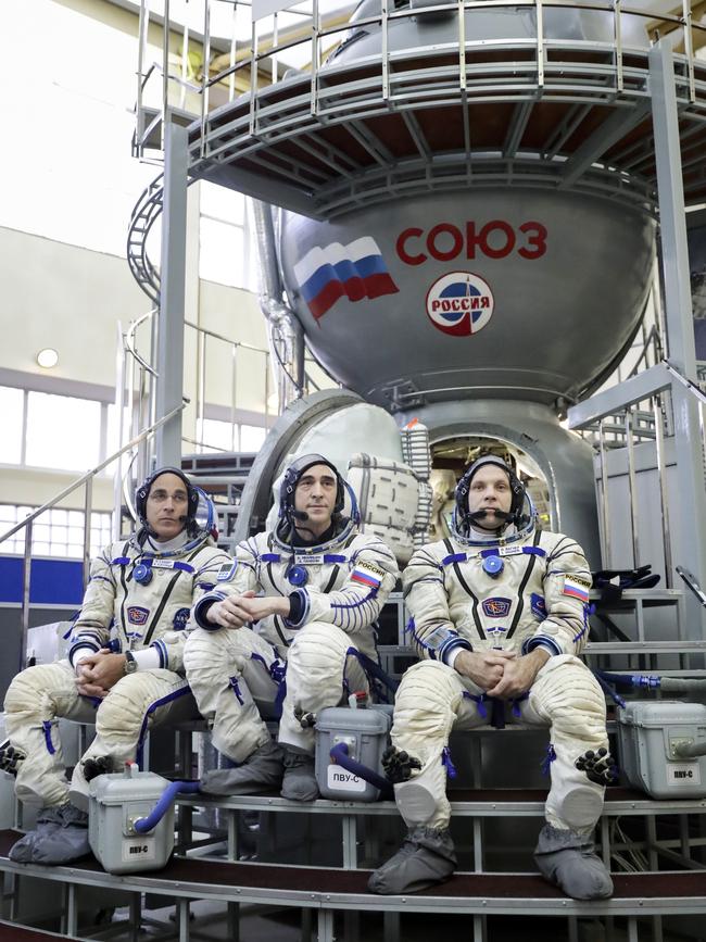 Christopher Cassidy, left, Russian cosmonauts Anatoly Ivanishin, centre, and Ivan Vagner are taking extra precautions against the virus. Picture: AP.