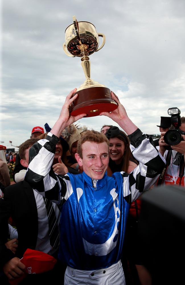 Jockey Ryan Moore with the Cup in 2014. Picture: Colleen Petch.