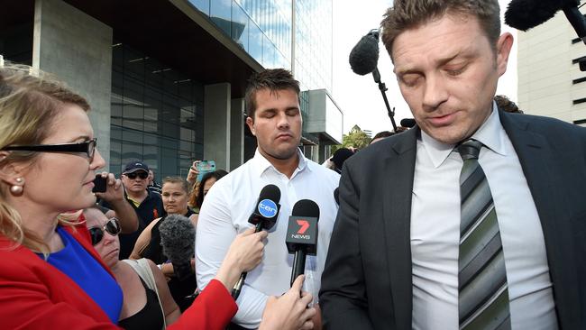 Gable Tostee leaves the Supreme Court with his lawyer Nick Dore (AAP Image/Dave Hunt).