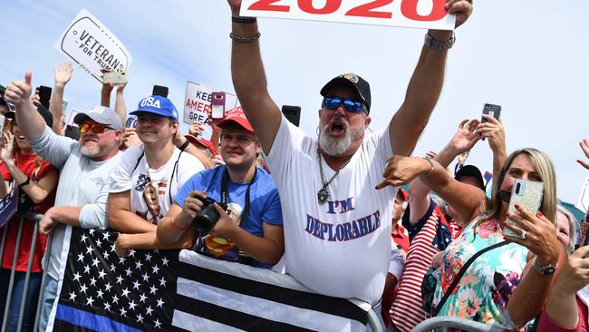 Supporters wait on the tarmac for Donald Trump’s arrival in Fletcher, North Carolina. Picture: AFP.