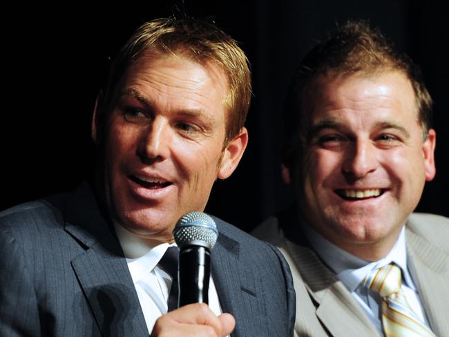 Teammates, mates: Shane Warne and Darren Berry.