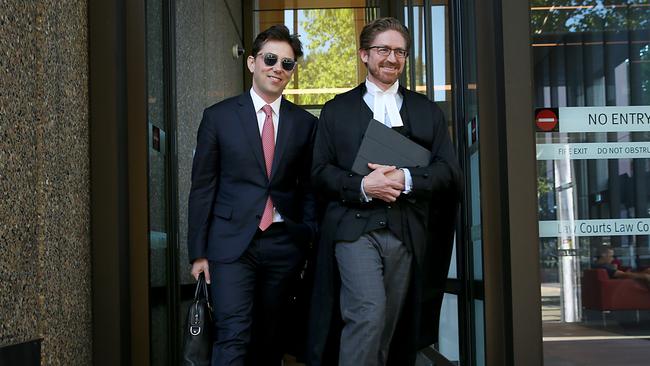 Journalist Joe Aston leaving Federal court with his lawyer in the defamation trial against Elaine Stead. Picture: Jane Dempster.