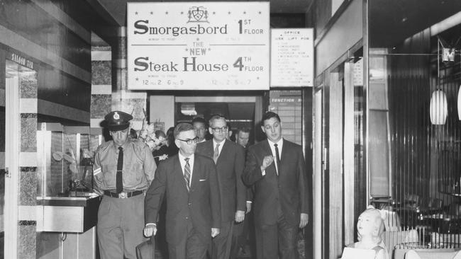 Royal Commission into police misconduct. Royal Commissioner Justice Harry Gibbs (second from right ) spent 30 minutes inspecting the National Hotel, Queen Street, Brisbane. Picture: The Courier-Mail Photo Archive