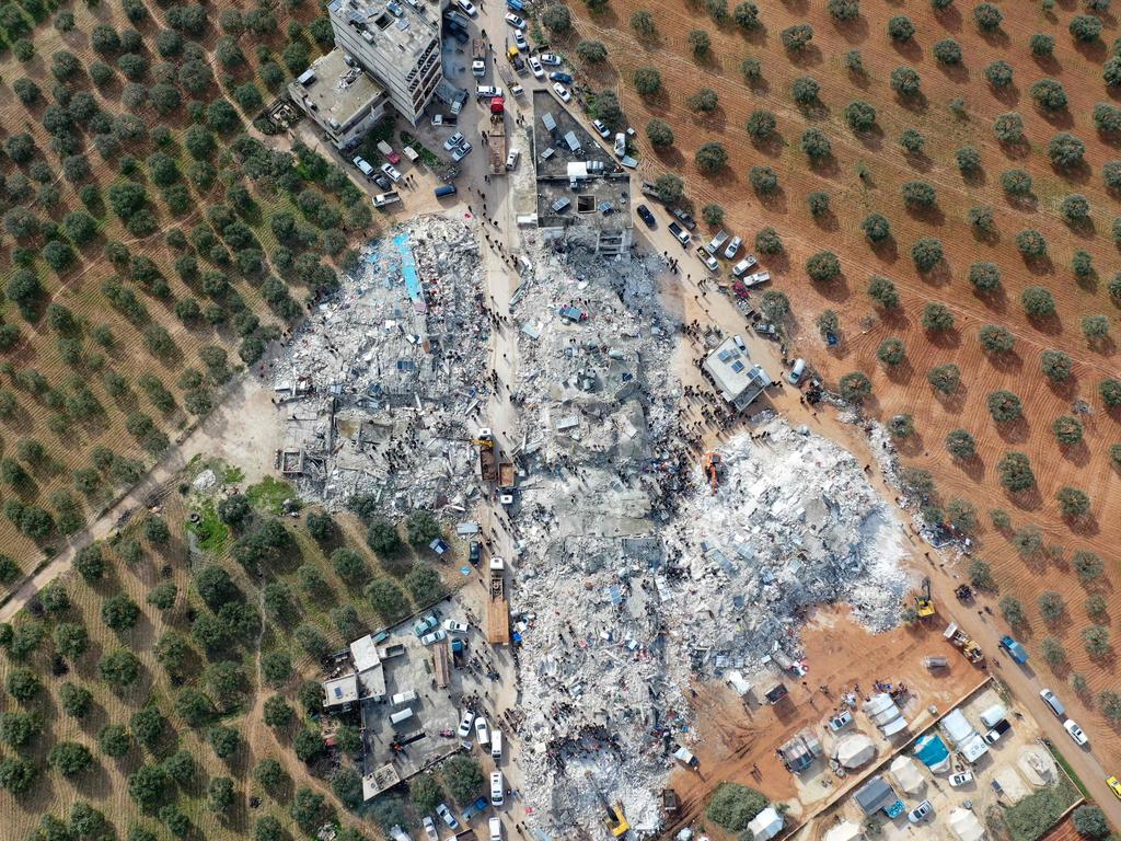 Residents searching for victims and survivors amidst the rubble of collapsed buildings following an earthquake in the village of Besnia near the town of Harim, in Syria's rebel-held northwestern Idlib province. Picture: AFP