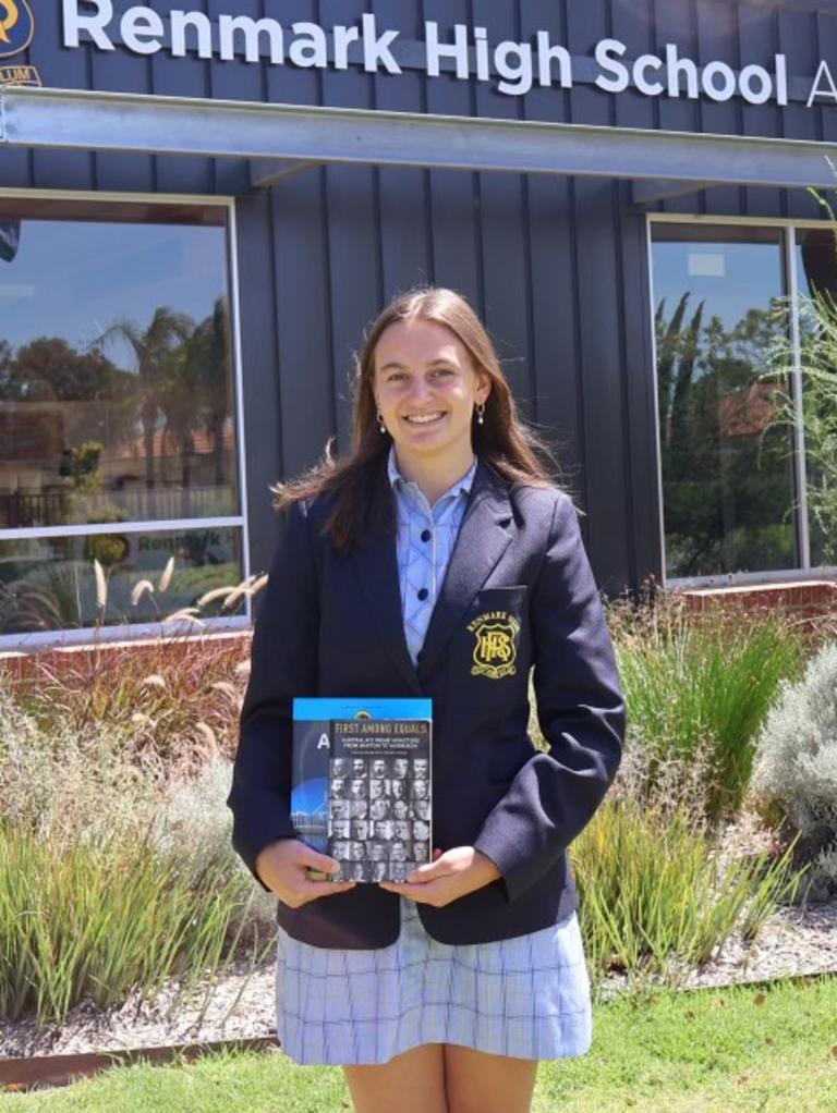 Teen Parliament 2024 scholarship recipient Rachel Files. Rachel pictured holding a book on Australian Prime Ministers which inspired her. Picture: Supplied.