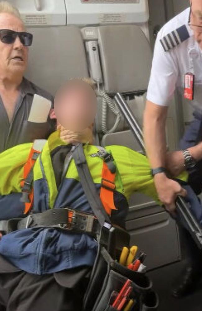 The 17-year-old was restrained by passenger Barry Clark and crew members. Picture: 9 News.