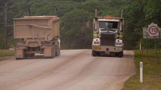 Christmas Island Phosphates trucks pass each other on the road to Phosphate Hill. Picture: John Pryke/AAP