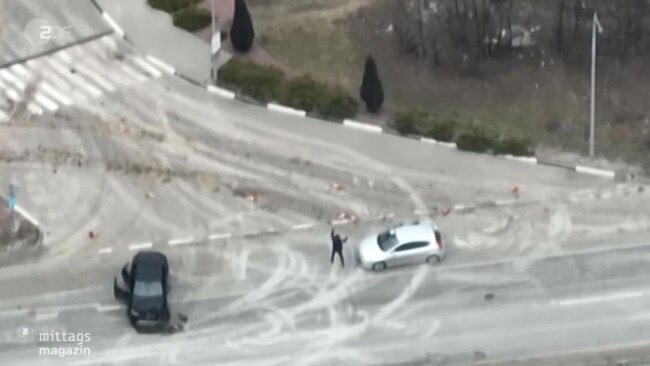 The man gets out of his car with his hands up. Picture: ZDF FRONTAL