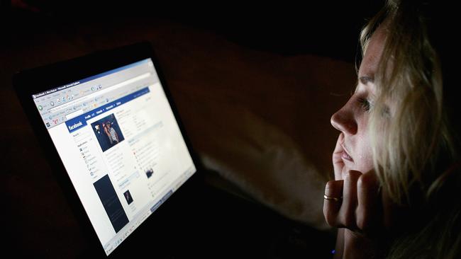 A girl browses Facebook in London. Picture: Getty