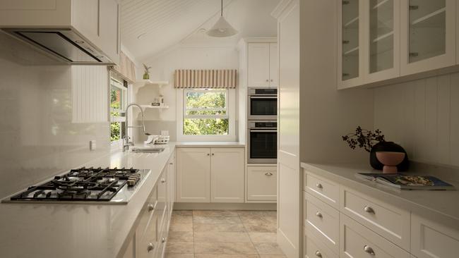 The large kitchen is filled with modern appliances.