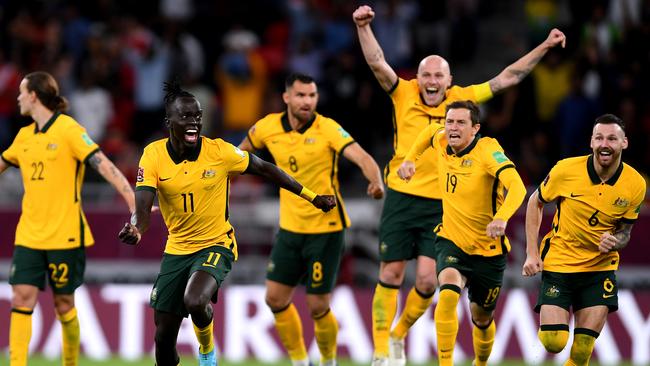 Australia celebratethe historic win. Photo by Joe Allison/Getty Images.