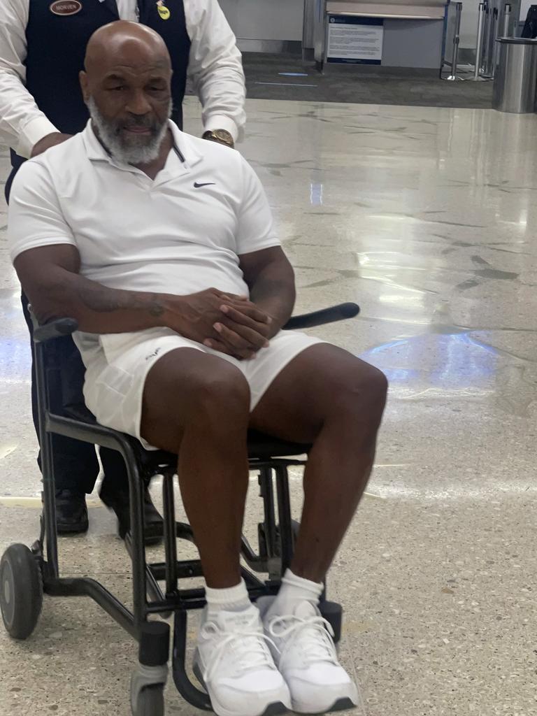 Mike Tyson is pictured in a wheelchair at Miami International Airport. Picture: TheImageDirect.com