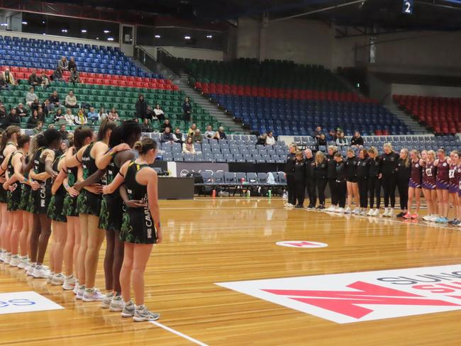 Cavaliers and Cripps Waratahs players hold a moment's silence after their TNL clash on Saturday. Picture: Jon Tuxworth