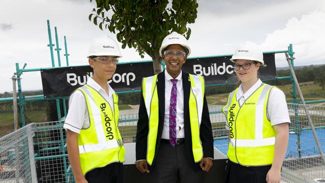 Students Jessica Boland and Vito Galati together with Santa Sophia Catholic College Principal Mark De Vries onsite