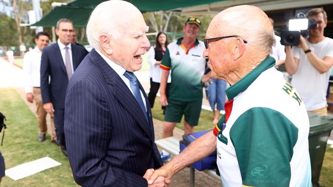 Mr Howard greets a patron at the Modbury bowls club. Picture: NCA NewsWire / Kelly Barnes