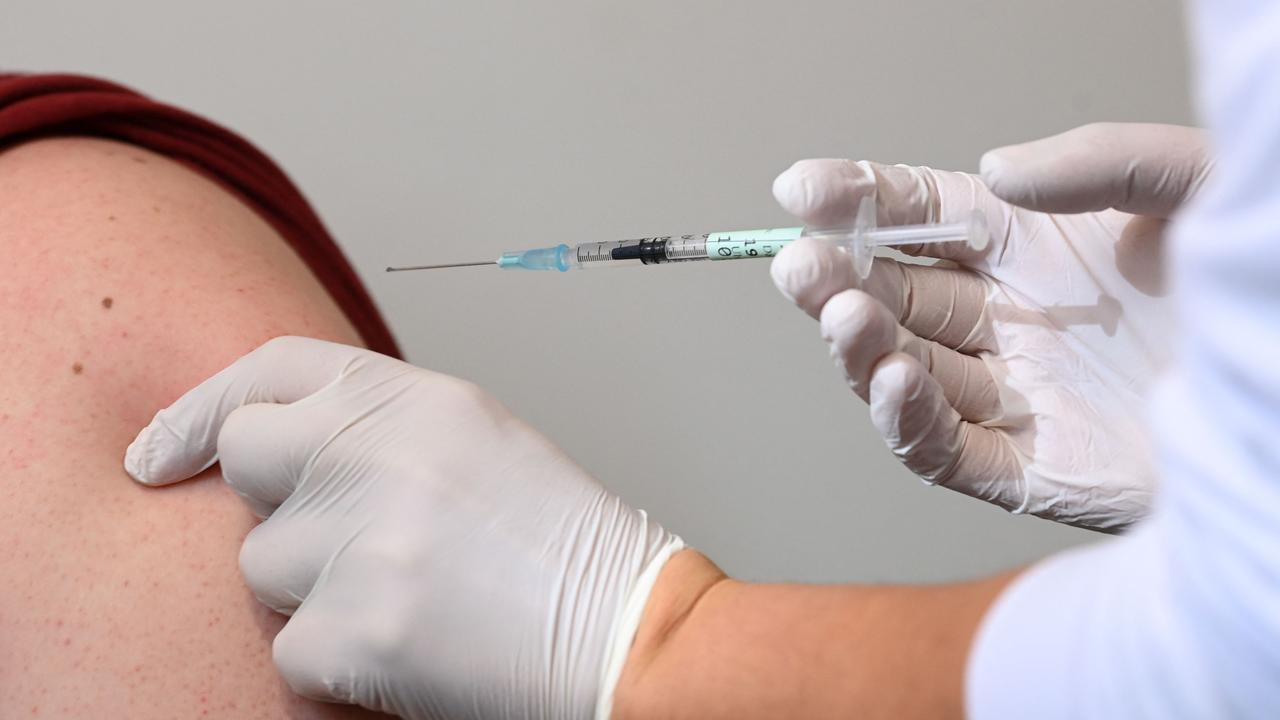 A doctor vaccinates a patient in vaccination centre in Haar near Munich, southern Germany.