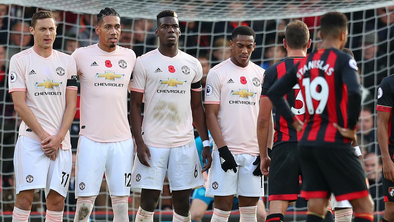 Nemanja Matic lines up with team mates. (Photo by Catherine Ivill/Getty Images)