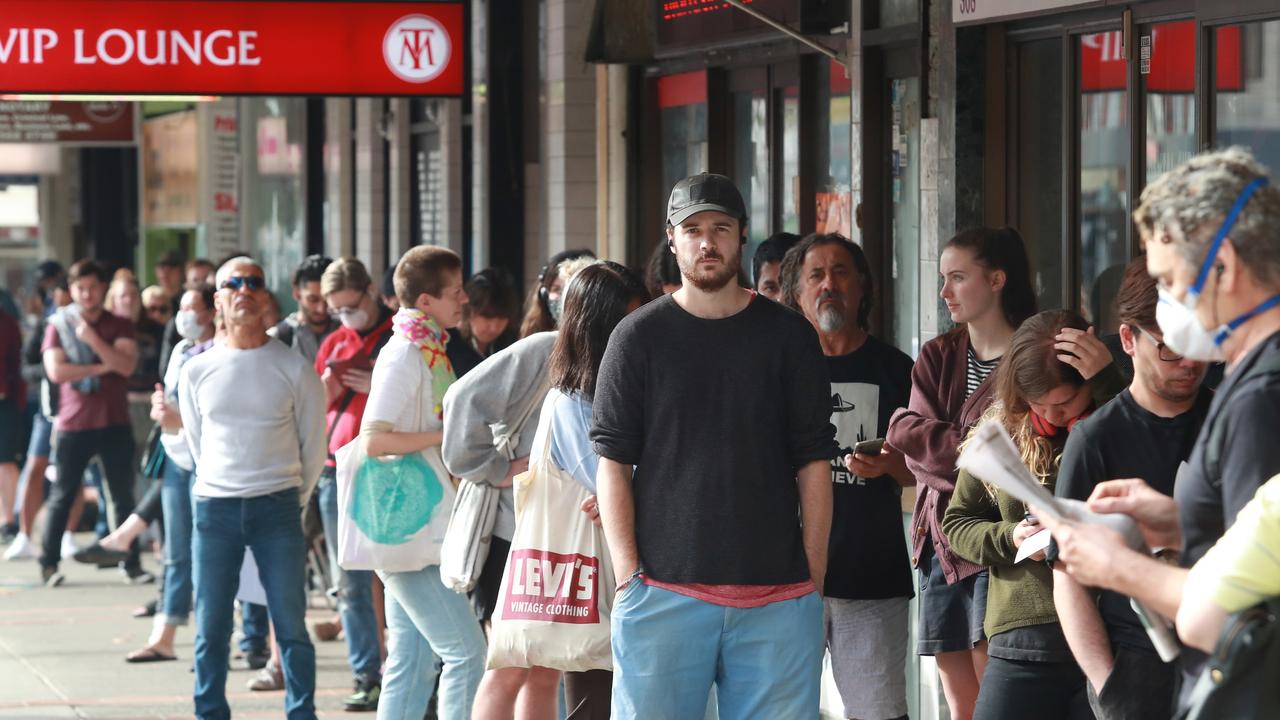 People queue at a Sydney Centrelink in March, days before the business-saving JobKeeper program was announced. Picture: John Feder/The Australian