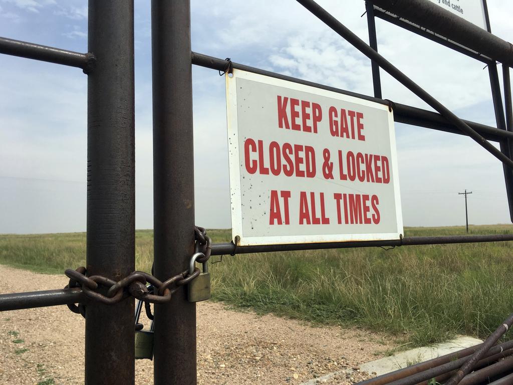 A locked gate at an entrance to a ranch in Colorado’s eastern plains, near where police say the bodies of Shanann Watts and her daughters Bella and Celeste were discovered at an oil work site. Picture: AP Photo/Dan Elliott