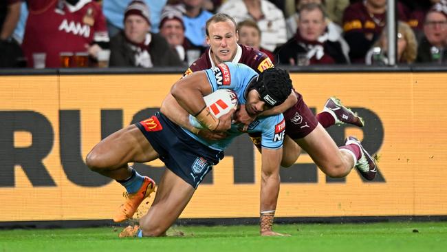 Stephen Crichton taken down by Daly Cherry-Evans in an iconic Origin tackle.