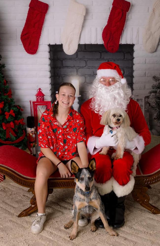 Paige Brady and her dogs, Ella (Maltese) and Skylar (Cattle Dog), with Santa: Studio Thirtytwo studio 2023 - Rockhampton. Sent in by Jodie Brady.