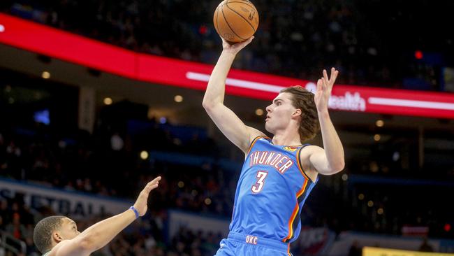 OKLAHOMA CITY, OKLAHOMA - JANUARY 03: Josh Giddey #3 of the Oklahoma City Thunder shoots over Grant Williams #12 of the Boston Celtics during the first quarter at Paycom Center on January 03, 2023 in Oklahoma City, Oklahoma. NOTE TO USER: User expressly acknowledges and agrees that, by downloading and or using this photograph, User is consenting to the terms and conditions of the Getty Images License Agreement.  (Photo by Ian Maule/Getty Images)