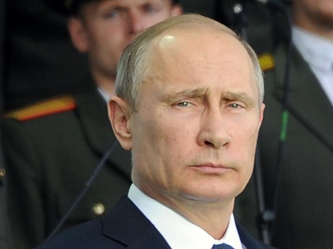 Russian President Vladmir Putin (C) attends a celebration of the 700th anniversary of St. Sergius of Radonezh in the Trinity St. Sergius monastery in Sergeiv Posad outside Moscow on July 18, 2014. AFP PHOTO / RIA NOVOSTI / MIKHAIL KLIMENTYEV