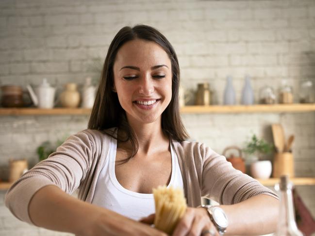 Woman cooking spaghetti