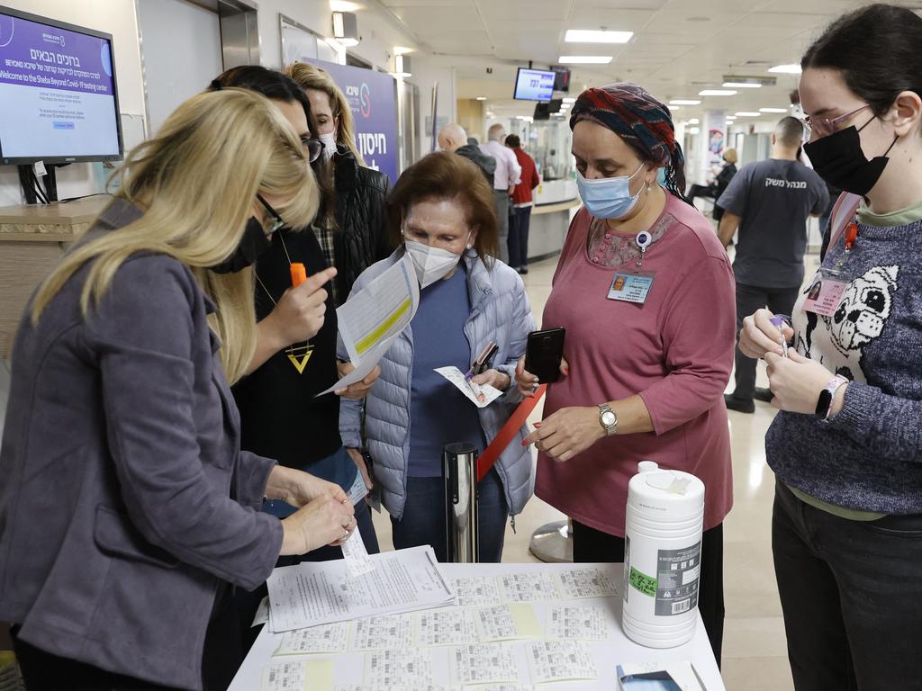 Staff volunteers queue to receive a fourth dose of the Pfizer-BioNTech coronavirus vaccine at the Sheba Medical Centre in Ramat Gan near Tel Aviv. Picture: AFP