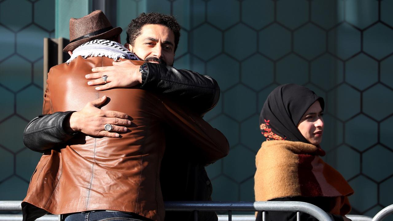 Survivors and family members gather outside the High Court building. Picture: Sanka Vidanagama/AFP