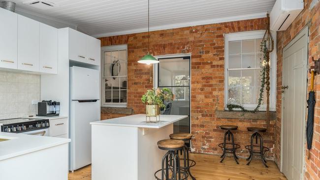 Exposed brickwork and restored floorboards creates a warmth in the home.