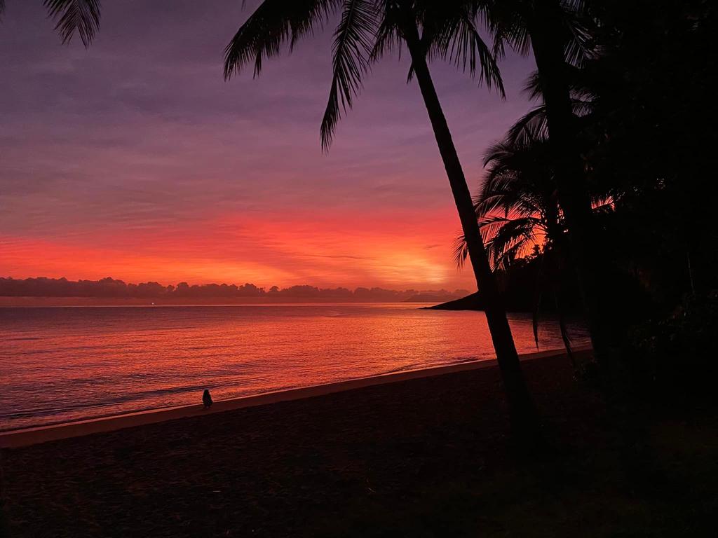 Sunlight scattered by volcanic ash made for a beautiful sunrise off Trinity Beach this morning. Photo: Danetta Lee