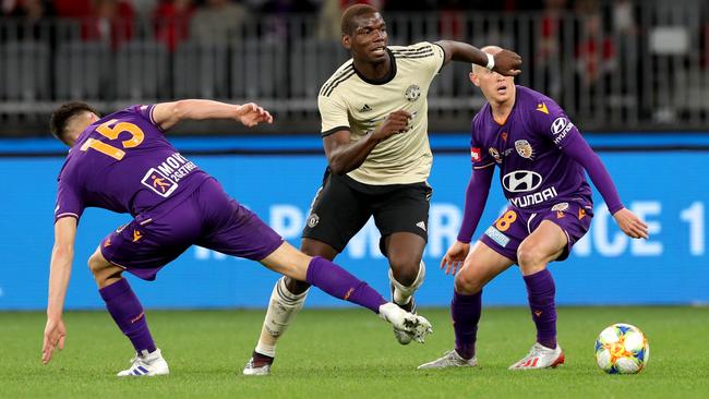 Manchester United’s Paul Pogba, centre, in action against Perth Glory at Optus Stadium last year. Picture: AAP