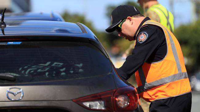 Police maintain checks at the NSW/Qld border at Griffith Street, Coolangatta as Covid 19 restrictions remain. Pics Adam Head