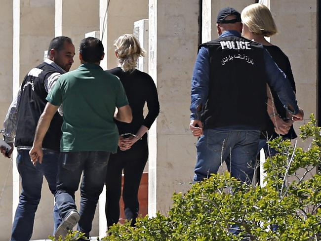 Police escort Australian Sally Faulkner, the mother of the Elamine children, and Australian reporter Tara Brown, to Lebanon's Baabda Prison for women, after their trial was adjourned. Picture: Reuters/Mohamed Azakir