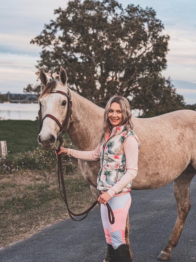 Hope Everson models an outfit from the Equestrian Rider Apparel Pink Floral collection.