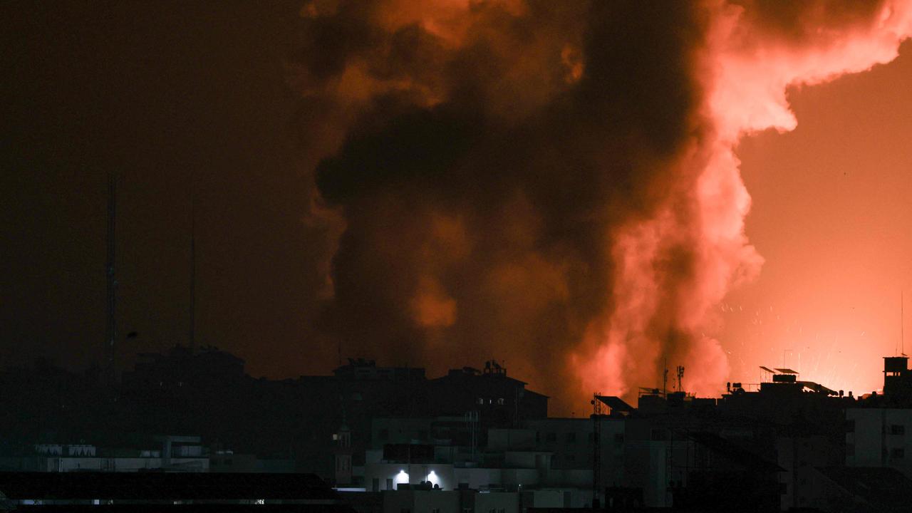 Fire and smoke rises above a building during an Israeli air strike in Gaza City on early October 8, 2023. Picture: AFP