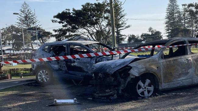 Burnt out cars in the middle of Crescent Head on Sunday morning, August 6.