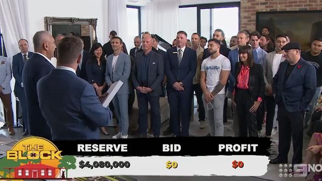 Adrian Portelli (looking casual in the white t shirt) said he was a genuine bidder at the fiery auction. Picture: Channel 9