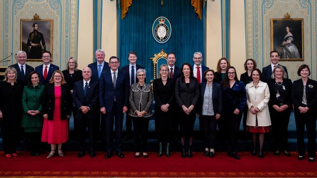 Daniel Andrews with his new ministers after they were sworn in on Monday.