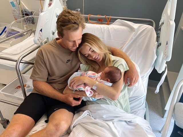 Savannah Mckell with son Elijah and husband Tom.