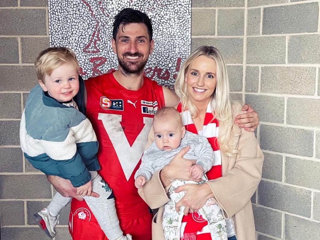 Former Port Adelaide Player Sam Mayes with his partner Cassie Burton and their two children.