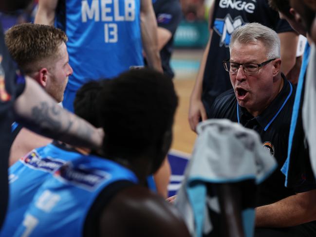 PERTH, AUSTRALIA - OCTOBER 04: Dean Vickerman, head coach of Melbourne United addresses his players at a time-out during the round three NBL match between Perth Wildcats and Melbourne United at RAC Arena, on October 04, 2024, in Perth, Australia. (Photo by Will Russell/Getty Images for NBL)