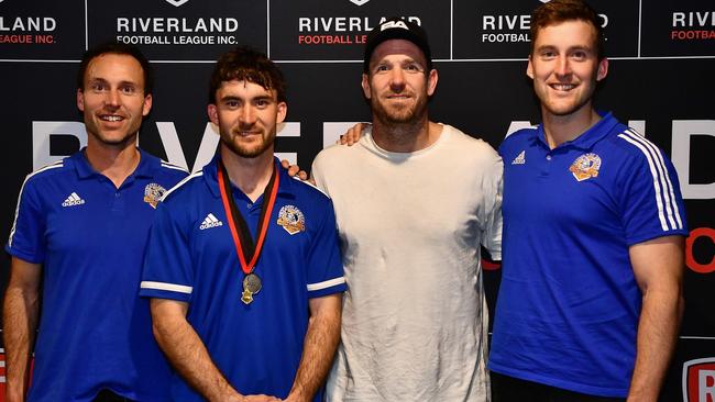 Dan Woolford (middle, left) with awards presenter Dane Swan, and Matt (left) and Tim Woolford. Picture: Grant Schwartzkopff