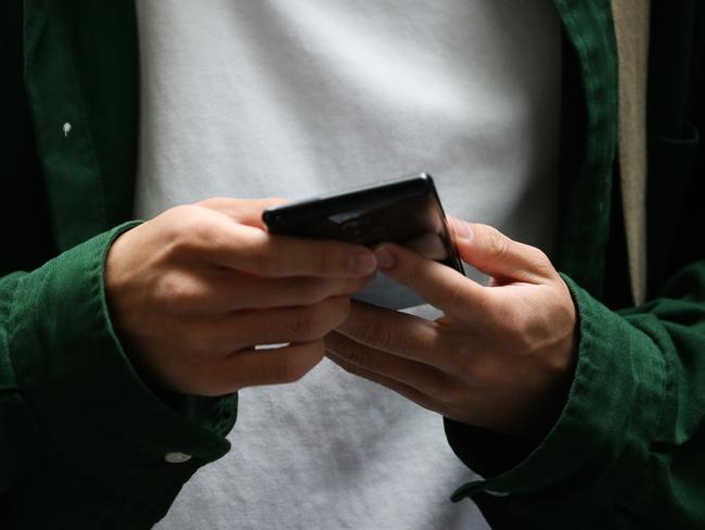 SYDNEY, AUSTRALIA - Newswire Photos DECEMBER 18, 2022: Members of the public are seen using their phone as the personal data of Australians is being stolen at a rate of more than 20 times above the global average new research reveals. Picture: NCA Newswire / Gaye Gerard